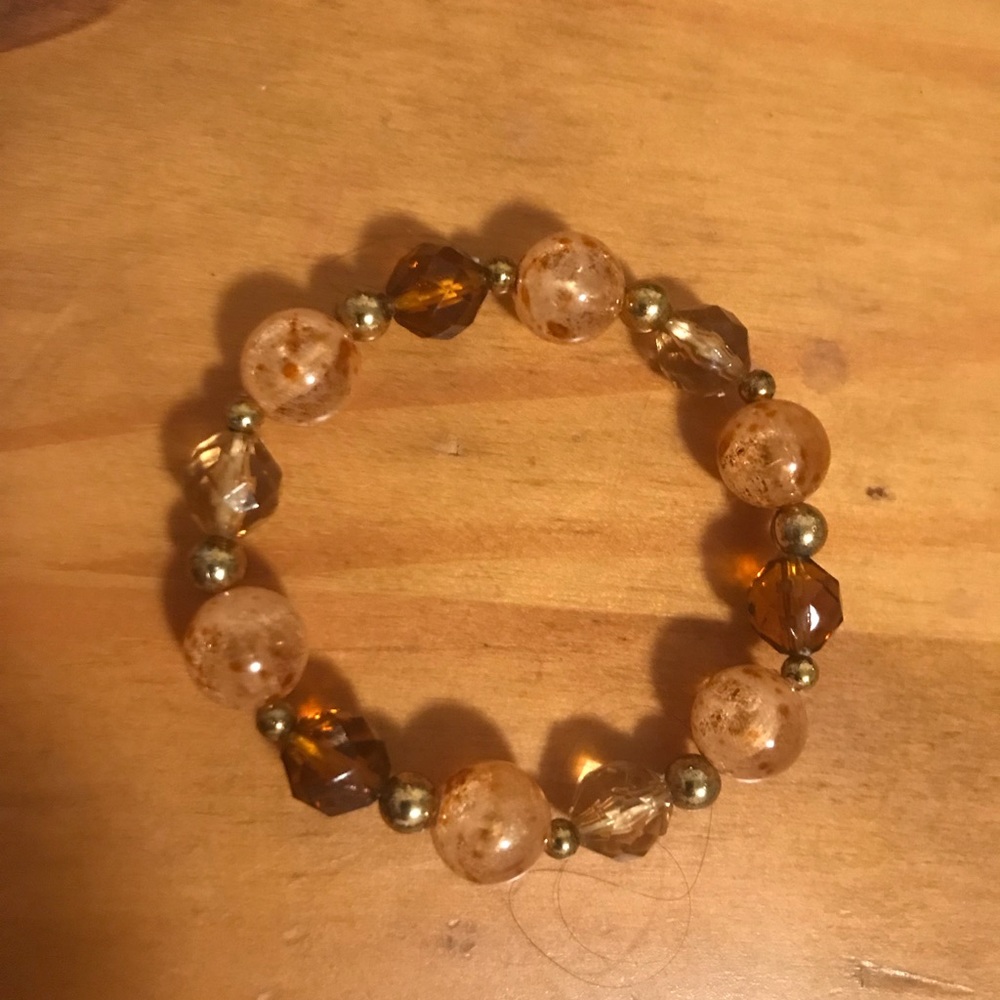 Bracelet with elastic. About 6 inch diameter.